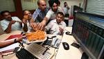 Record-hitting spree continues banks, stocks