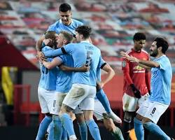 Football players celebrating a goal