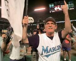 Image of Jim Leyland holding the World Series trophy