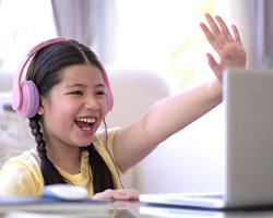 Image of child using a laptop in a safe and supervised environment