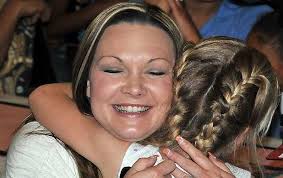 Deana Redding gets a hug from daughter MiKayla Curtis during the Mother&#39;s Day Tea at Eisenhower - 1A-TEA-2-35-x-full