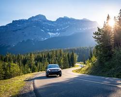 Image of car driving on a scenic highway