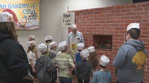 Children bake handmade matzah at Chabad’s Model Matzah Bakery event