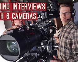 Image of documentary filmmaker filming social issue interview camera equipment cinematic lighting social mirror concept nonAI photo 2026