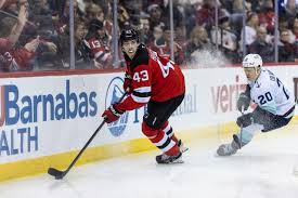 Luke Hughes of the New Jersey Devils on the ice during a game
