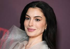 Anne Hathaway Pairs Sleeveless Sheer Gown Made of Mesh Ribbons With $67,000 Diamond and Emerald Earrings