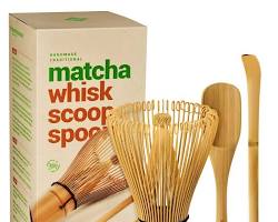 Image of matcha powder and a bamboo whisk