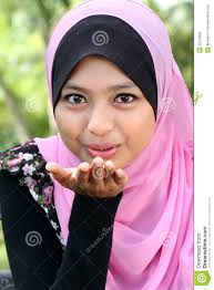 Portrait of cute young muslim female blowing kiss. MR: YES; PR: NO - portrait-cute-young-muslim-female-22110695