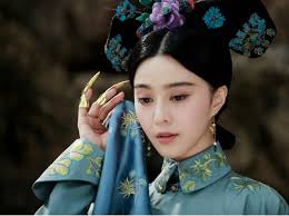 Photos show Fan Bingbing, a famous Chinese actress, in the costume of a queen in Qing Dynasty (1644-1912) in Chengde Summer Resort in Hebei Province. - F201306281649195906203635