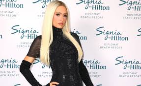 Paris Hilton unveils shocking dark brunette hair and sweeping fringe, making her look totally unrecognisable