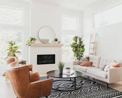 Image of living room with a cream rug and white sofa