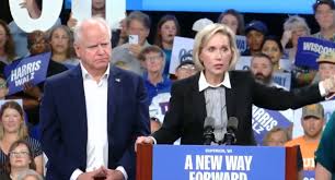 ‘So Cringe’: Conservatives Mock Tim Walz Wife For Belaboring Exaggerated 
‘Turn the Page’ Gesture at Rally