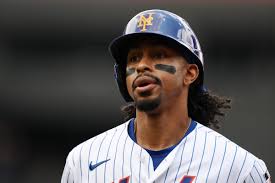 New York Mets and Cleveland Guardians players during an MLB game