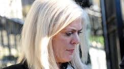 Bleached blonde crook Kathy Ward arrives at court in Downpatrick rather camera shy - Kathy-Ward-2