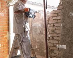 interior wall demolition concrete breaking renovation contractor، من إنشاء الذكاء الاصطناعي