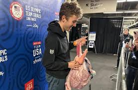 A Pink Backpack and an Odd Phone Case Are US Speedskating's Fantasy Football Punishments