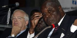 Nation Media Group directors Gerard Wilkinson (left) and Martin Aliker follow through the speeches during the 48th annual general meeting held at the KICC ... - aliker