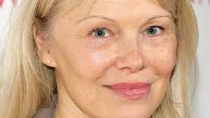 Pamela Anderson, 59, looks decades younger in winning white look - and not an ounce of makeup