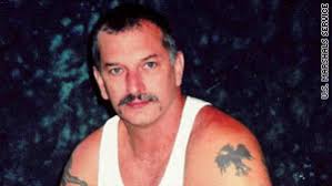 John Charles McCluskey, 45, seen here in 2005, is described as armed and dangerous. - story.john.mccluskey.usm