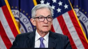 Powell holds US interest rates steady in what is likely his final decision as Fed chairman