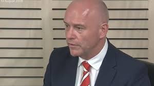 Phone of Catholic Schools NSW boss Dallas McInerney could be seized by ICAC after weekend ‘surrender’; investigation into corruption continues.