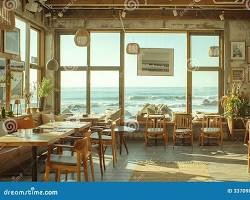 scenic cafe interior with large windows overlooking the oceanの画像