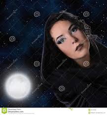 Witch - witch-girl-black-cape-looks-down-background-moon-sky-35376003