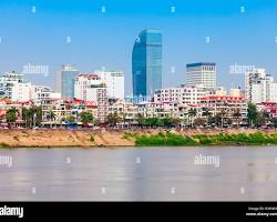 Image of Phnom Penh skyline at sunset, showcasing the Tonle Sap River and city lights