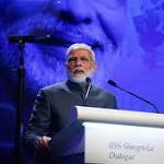 China Reacts Coolly India Expands