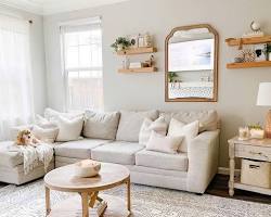 Image of living room with a beige rug and beige sofa