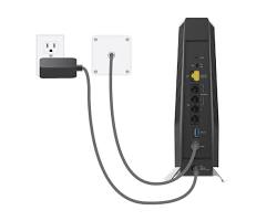 Connecting a modem to a wall outlet using a coaxial cable