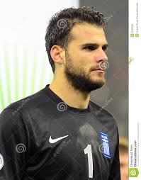 Editorial. Editorial image. Not to be used in commercial designs and/or advertisements. Click here for terms and conditions. - orestis-spiridon-karnezis-fifa-world-cup-playoff-game-greek-goalkeeper-pictured-action-warm-up-play-off-35405622