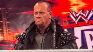 Image result for brock smiles at undertaker