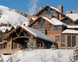 Skiers enjoying the uncrowded slopes at Yellowstone Club