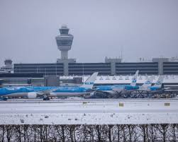 Amsterdam airport cancels at least 700 flights because of snow and wind