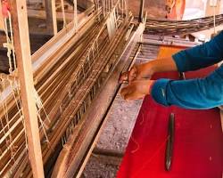 Image of Cambodian artisans weaving silk