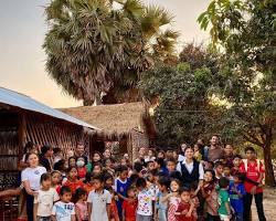 Image of volunteers interacting with children in a Siem Reap school