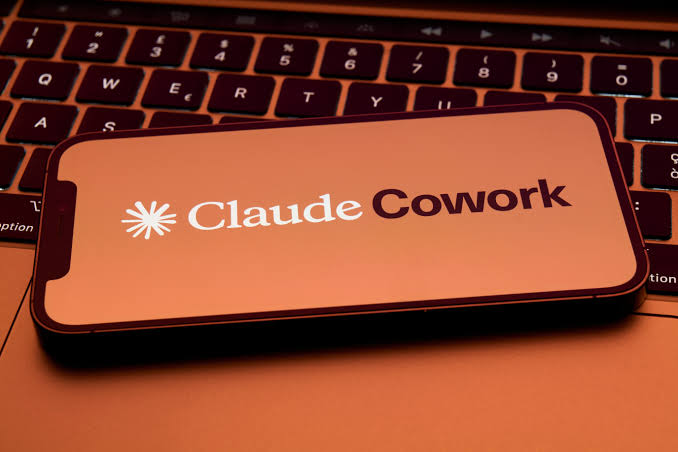 Anthropic expands Claude Cowork AI agent to mobile and web, targeting busy work as it softens job-loss rhetoric.