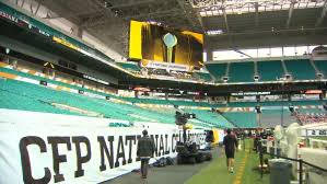 Officials put on finishing touches to field at Hard Rock Stadium as fans count down final minutes to CFP championship game