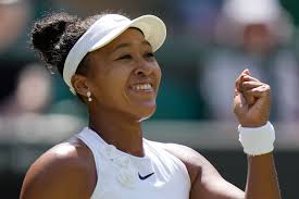Naomi Osaka celebrates her Wimbledon victory