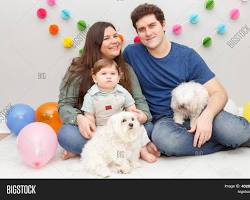 family with a baby and a pet celebratingの画像