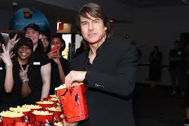 Tom Cruise enjoying popcorn at a movie screening