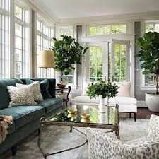 Image result for Few accents also help create a mellow mood. Here, a low-lying bed aligned with a light wooden bedside table and simple potted plant.