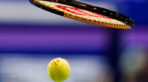 Empty professional tennis court at dusk illustrating the 2026 Stefan Milicevic tennis match-fixing ban