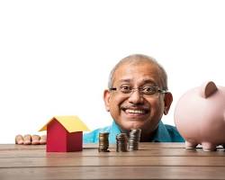 Image of person putting coins into a piggy bank with a determined expression