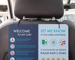 Image of frustrated parent trying to fit a car seat in an Uber