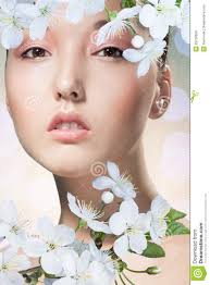 Beauty closeup portrait of beautiful Asian woman on abstract blurry background, front view, looking through spring cherry flowers. MR: YES; PR: NO - beauty-closeup-portrait-beautiful-asian-woman-abstract-blurry-background-front-view-looking-spring-cherry-flowers-29738958
