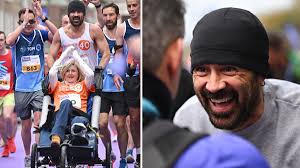 Colin Farrell completes Dublin marathon while pushing friend in a 
wheelchair, raises over $700,000 for charity