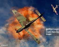 Image of Stuka dive bombers attacking enemy positions near German tanks