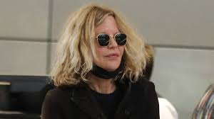 Meg Ryan masks up to catch flight out of LAX - amid report ex Dennis Quaid's comments about her and their son